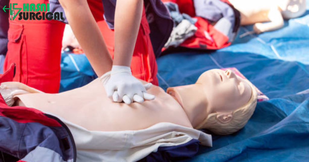 A trainee in a first aid course and performing CPR on a Mannequin.