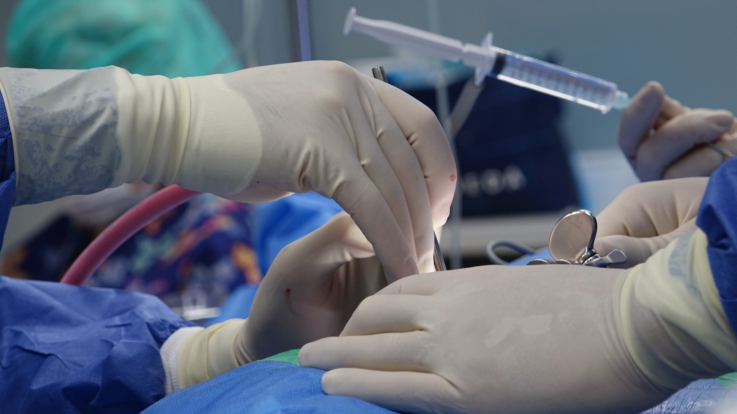 Close-up of surgeons hands performing precise spinal surgery with advanced stabilization tools in sterile operating room