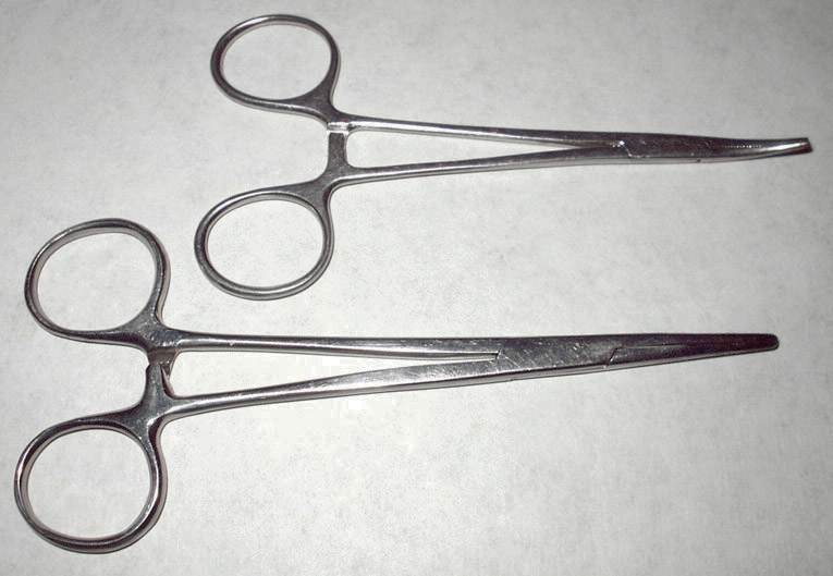 Hemostat surgical forceps clamp used to control bleeding during surgery